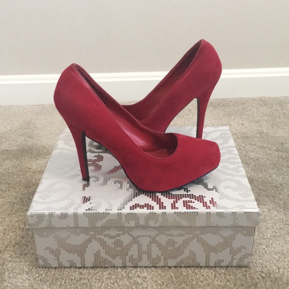 Red Pair of gently used stilettos.